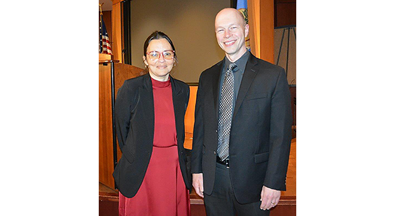 A man and a woman smiling.