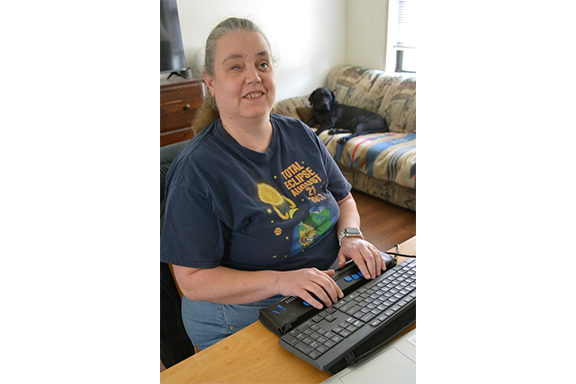 Woman sitting at computer.