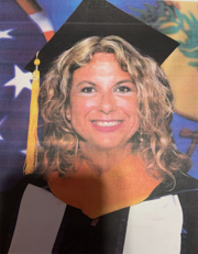 Photo of woman in cap and gown.