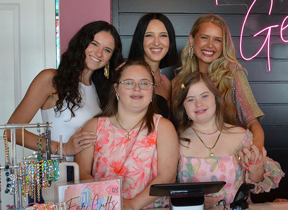 Six women who work together at Edmond jewelry business.