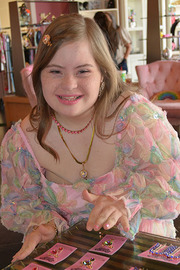 Another woman smiling while at work.