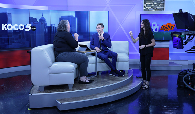 Woman being interviewed on television news program.