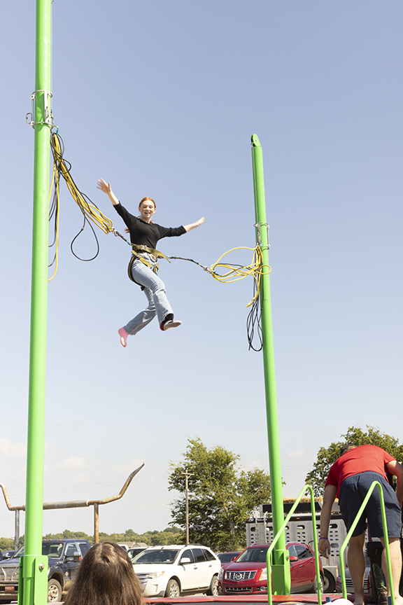 OSB student enjoys bungee jumping at event.