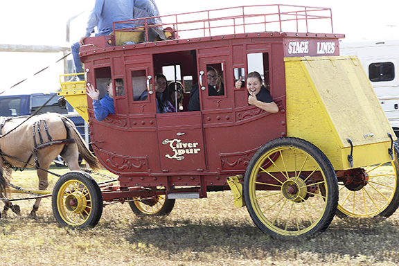 OSB students enjoying a ride in a stagecoach. 