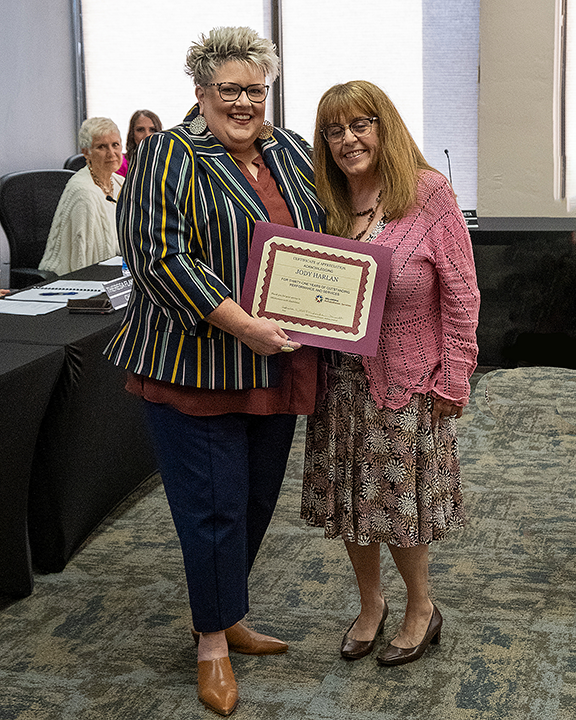 Woman receiving a certificate.