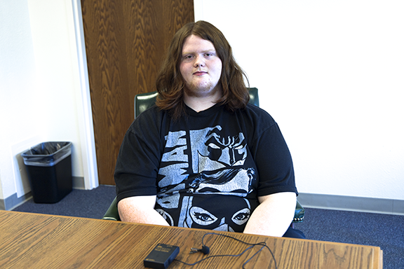 Man sitting at table.
