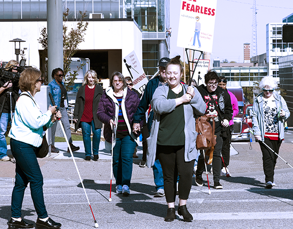 Group of white cane users marching in downtown Tulsa at last year White Cane Safety Day in 2024.