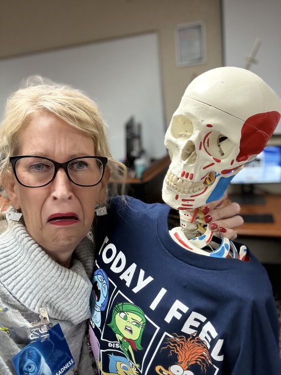 Woman posing with skeleton