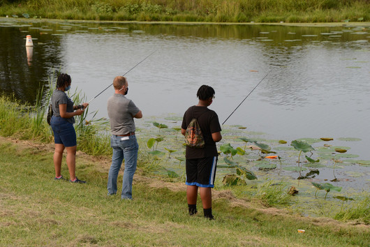 kids on pond fishing