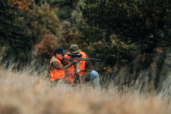 man and child deer hunting