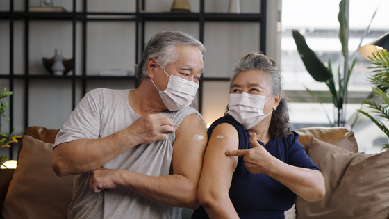 Photo of a couple who have just received vaccinations