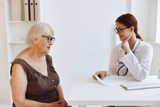 Photo of a health care worker with a female patient