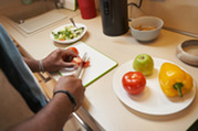 Photo of a man chopping vegetables