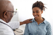 Photo of a doctor with a smiling patient