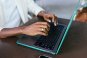 Photo of a person using a laptop computer