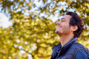 Photo of a man outside breathing in the fresh air
