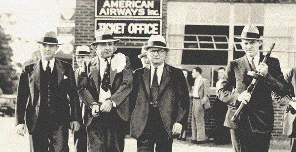 Police escorting Machine Gun Kelly to the Memphis airport, 1933.