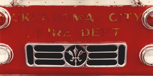 Grill of an Oklahoma City Fire Truck, gold lettering on the red truck