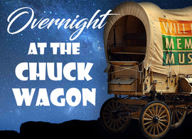 words read Overnight at the Chuck Wagon, a chuck wagon under the stars with the Will Rogers Memorial Museum on the canvas canopy