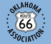 Route 66 Association logo in the shape of an interstate road sign with a blue background