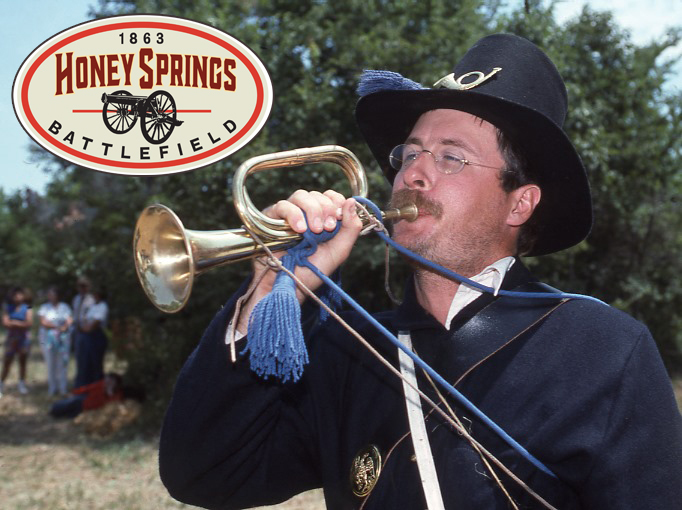 A reenactor dressed in union blue blowing a trumpet. The Honey Springs Logo with a cannon image is at the upper left.