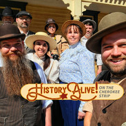 A group of living history reenactors gathered for a selfie with the words History Alive on the Cherokee Strip below