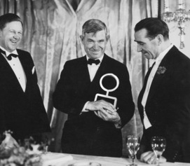 Will Rogers accepting his Oscar, the award has been replaced with a Dog Iron award