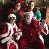 Santa Clause and two elves dressed for the season at the Will Rogers Birthplace Ranch