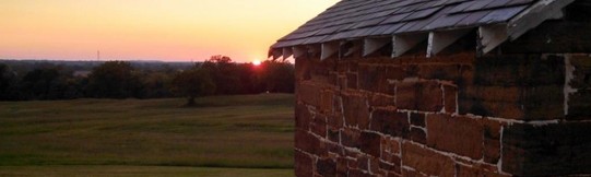 Fort Gibson stone building looking west to the sunset