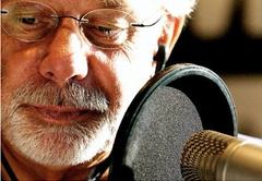 John Erling at the microphone conducting an interview for the Voices of Oklahoma project.