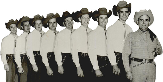 a grouping of men in western swing outfits and cowboy hats. Bob Wills and the Texas Playboys standing in line