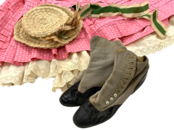 A pink skirt, white petticoat, a womans straw hat, and button style shoes worn by Shirley Jones in the 1955 film Oklahom