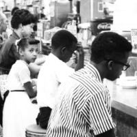 65th anniversary of Sit Ins, photo of a family seated at the Katz Drugstore in 1958