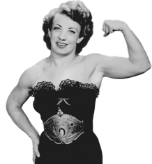 Mildred Burke, 1953. The wrestler is wearing a black one pice outfit with a world champion belt, making a bicep curl for the camera.