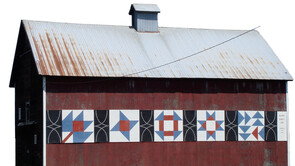 A red barn with wooden quilt pattern design