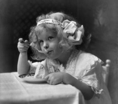 A young girl eating ice cream