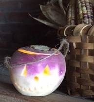 A turnip Jack-O-Lantern sitting on the mantle at Hunter's Home.