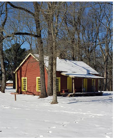 A snowy scene of the Sutler's Store at Fort Towson