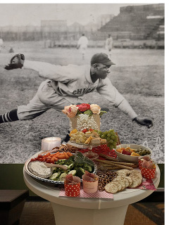 A mural of a baseball player and refreshments in the foreground