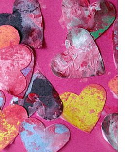 Fingerprinted hearts made by children from construction paper