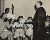 A group of students from Douglass High School ochestra rehearsing with instructor Zelia Page Breaux, 1946.