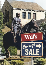 Will Rogers Garage Sale signs in foreground of the Will Rogers on Horseback statue in front of the Will Rogers Memorial Museum