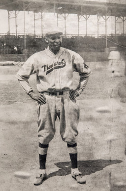 Walter "Bulelt Joe" Rogan standing on the baseball field