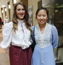 Two students in historical clothing standing together in the Oklahoma History Center on OkNational History Day Competition