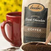 Bedre Dark Chocolate coffee package next to a red mug