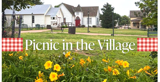A photo of the Humprey Heritage Village with the words Picnic in the Village and a picnic cloth motif