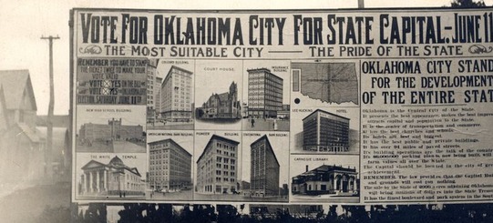 A billboard that reads "Vote for Oklahoma City for State Capitol. - June 11. The most suitable city, the pride of the state.