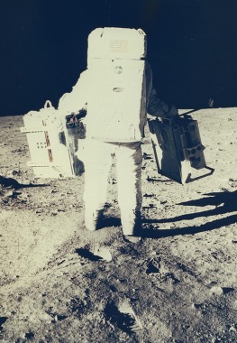 Moon Landing showing Buzz Aldrin walking on the moon carrying equipment