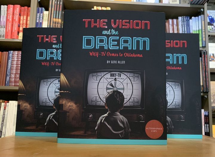 The Vision and the Dream book perched on a table in front the a bank of books at the OHCM Store.