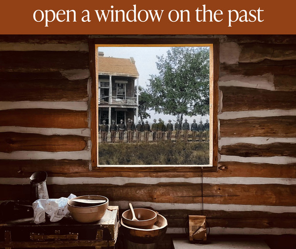 A banner that reads "open a window on the past" and an historic photo seen through a window of a log cabin.